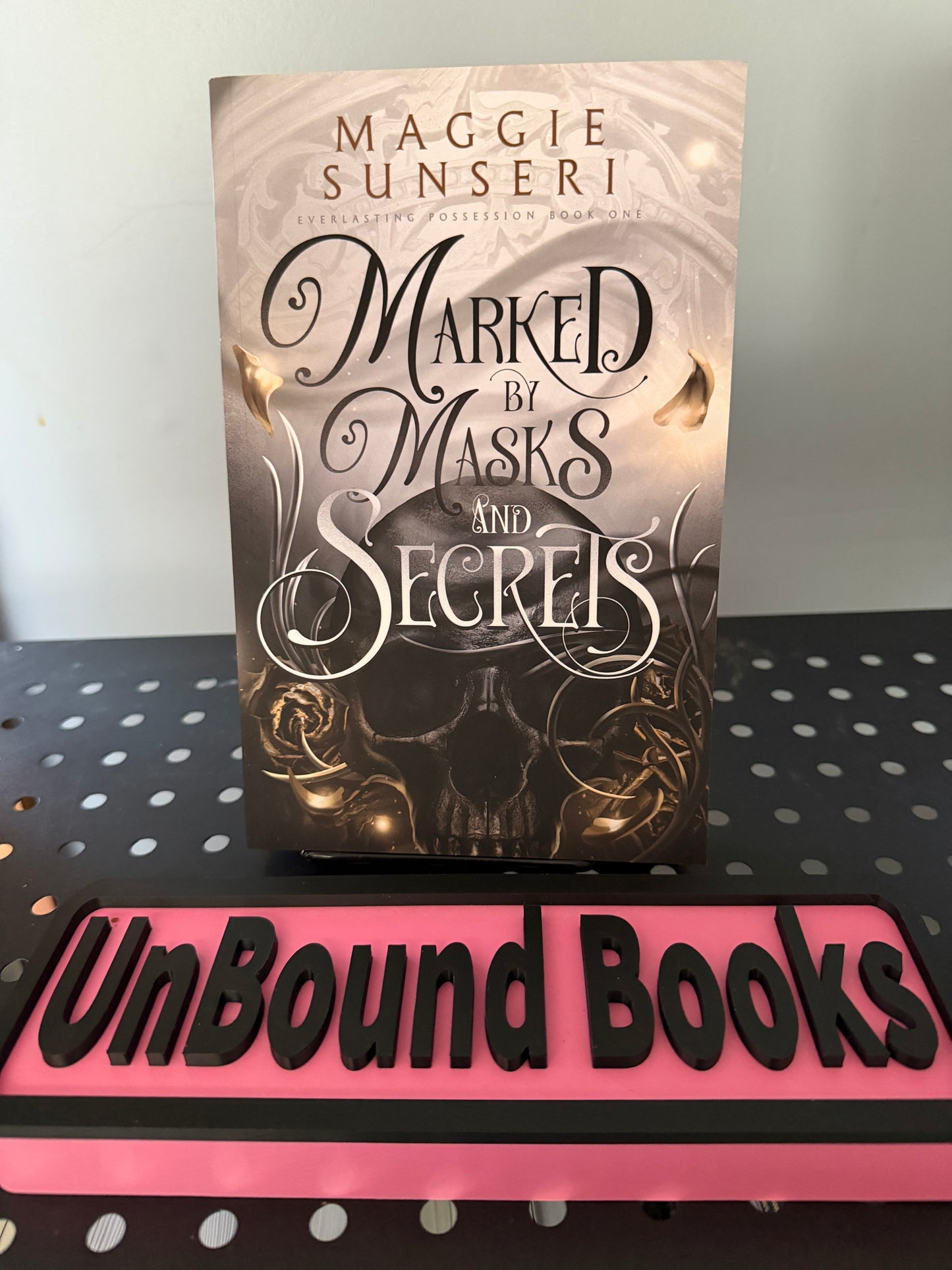 Marked by Masks and Secrets